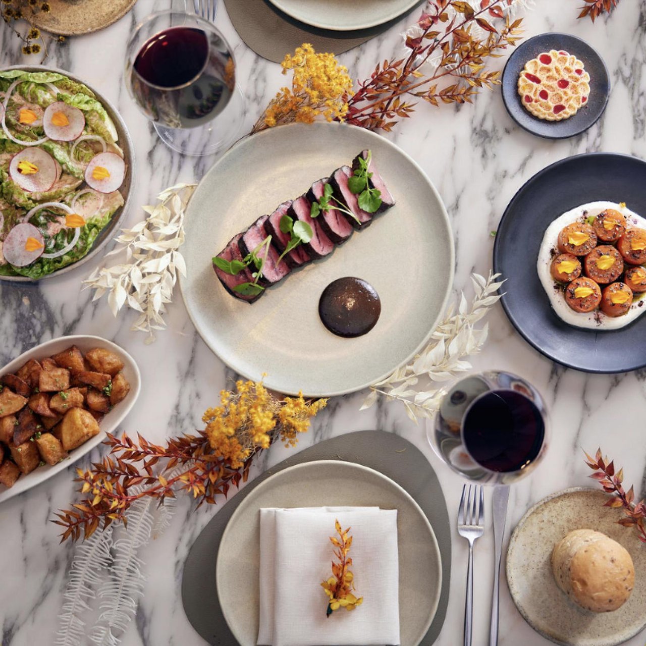 Seasonal fall dishes and drinks served at a Tampa Bay-inspired restaurant table