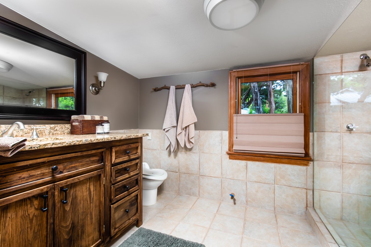 Primary Bathroom with walk-in frameless glass shower