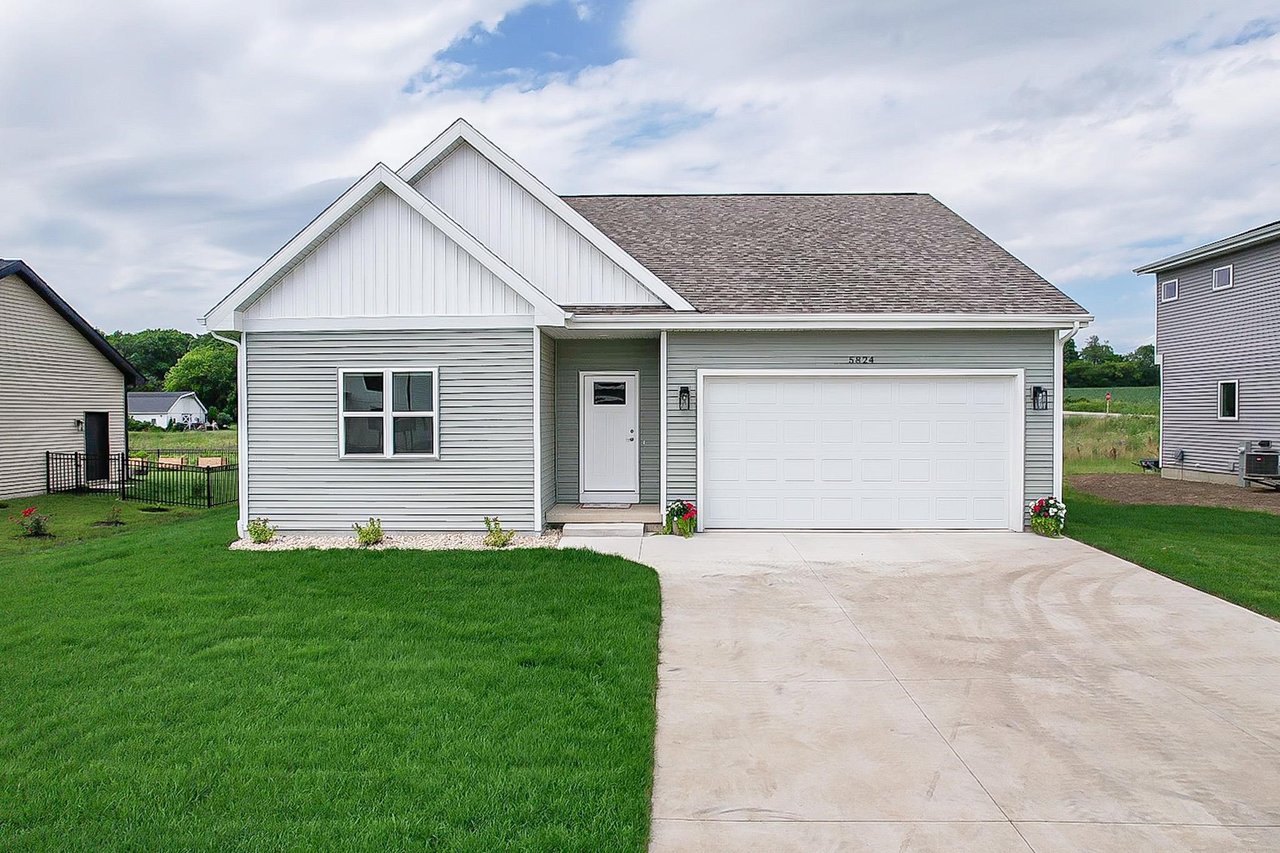 A single level Madison home with an attached garage and a level driveway, the kind of step-free access that matters most during Wisconsin winters.