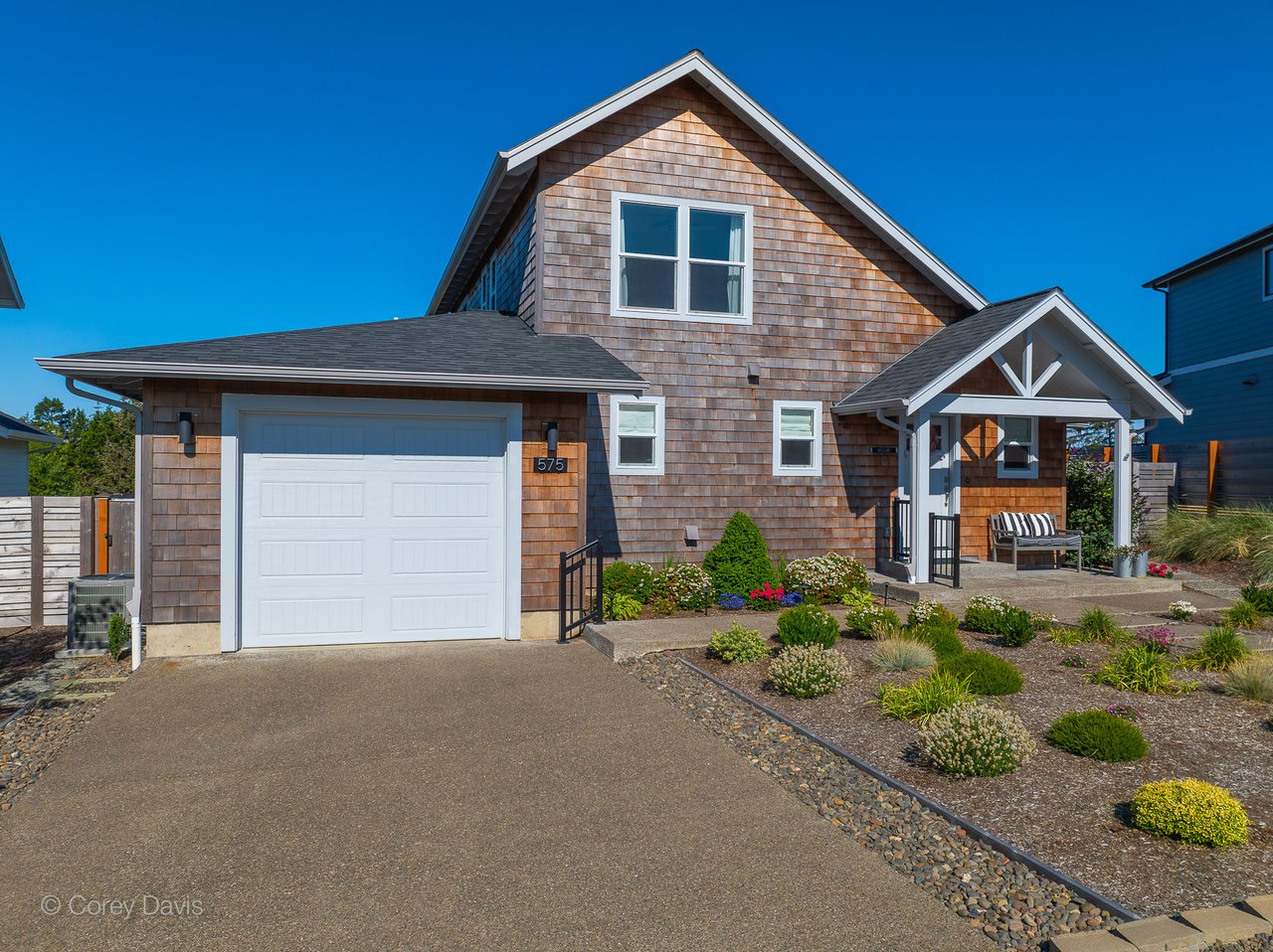 shingled manzanita home on a sunny day with a blue sky