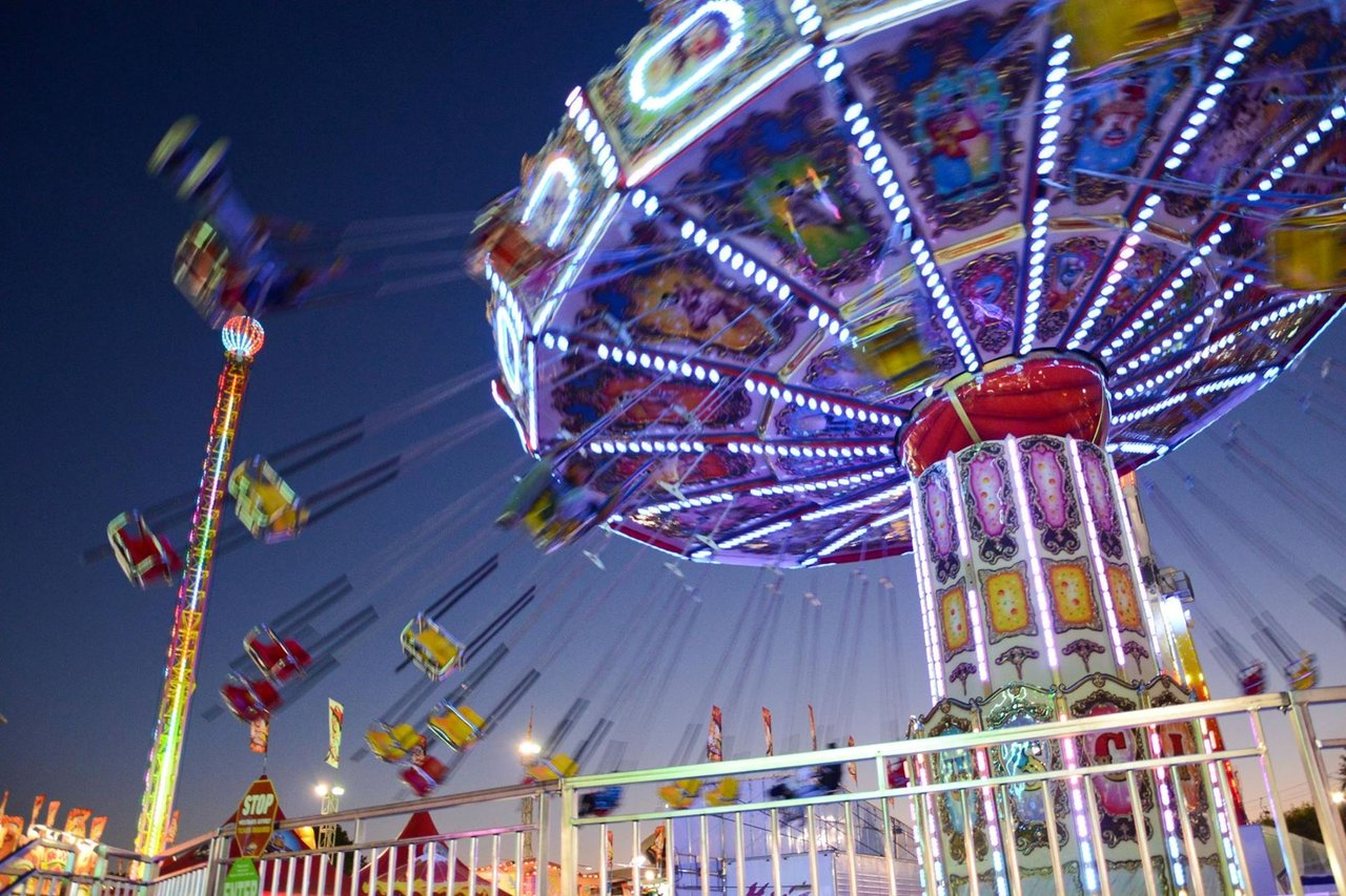 Carnival rides and lights at the OC Fair in Costa Mesa, minutes from Newport Beach
