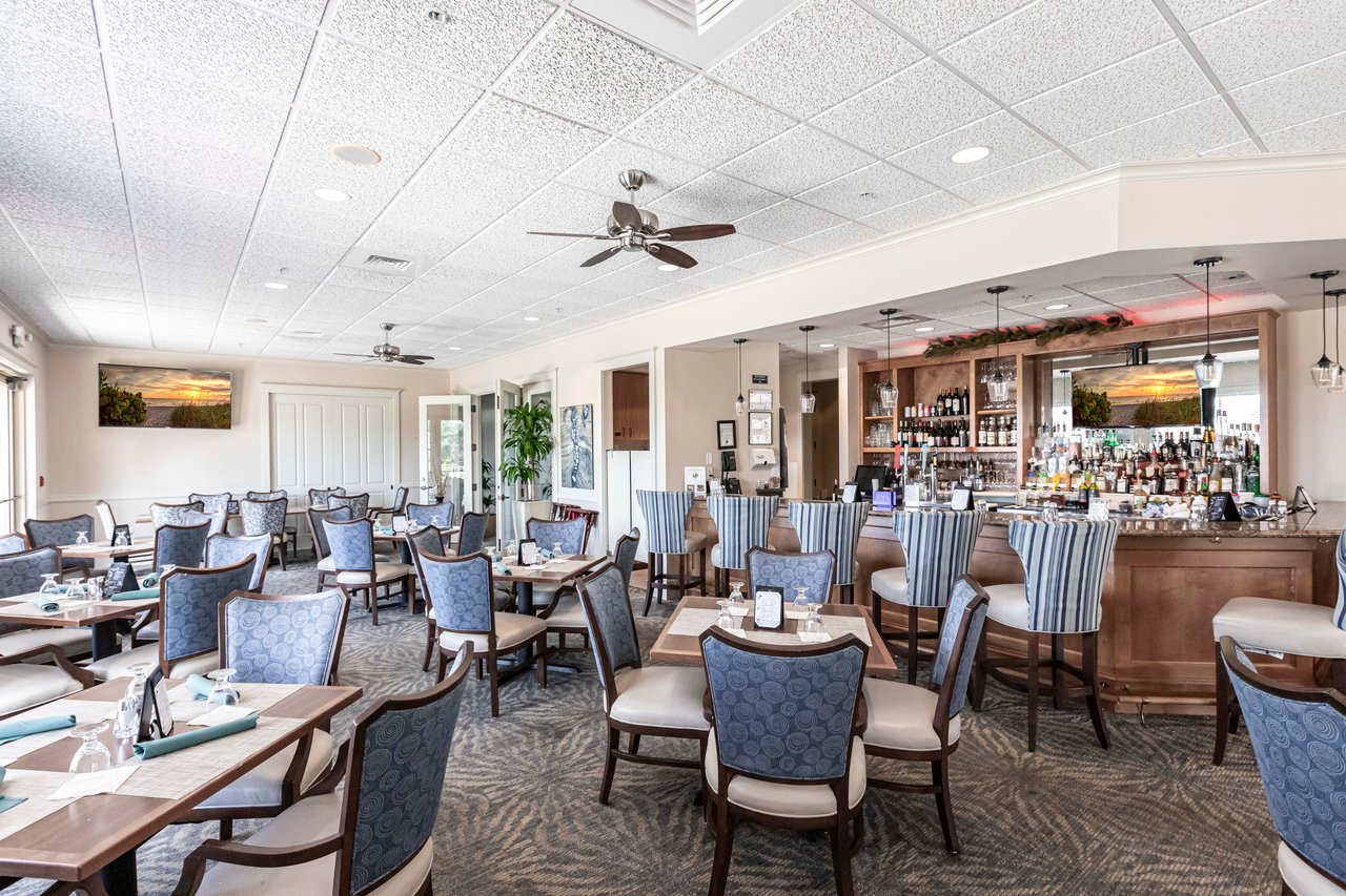 Formal dining room inside the Longshore Lake clubhouse with lake views