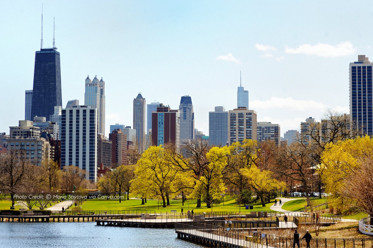 Chicago skyline beyond Lincoln Park’s autumn trees and waterfront walkways.