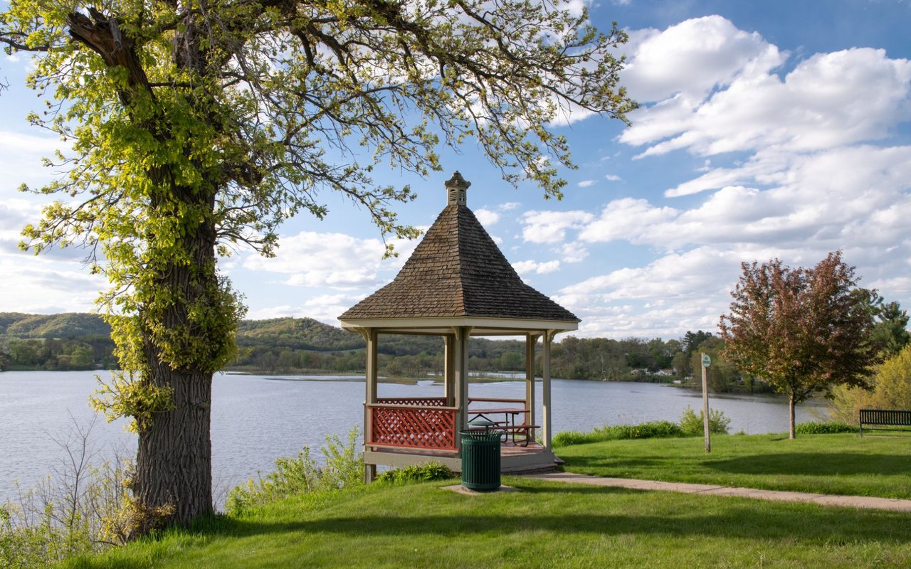 Scenic view of Trempealeau County, Wisconsin, highlighting the Mississippi River, rolling hills, and lush landscapes of the Driftless Region, showcasing the area’s natural beauty and small-town charm.