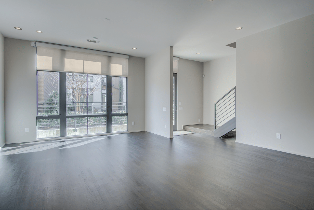 Before staging: Empty living room, the starting point for home improvements with Compass Concierge.