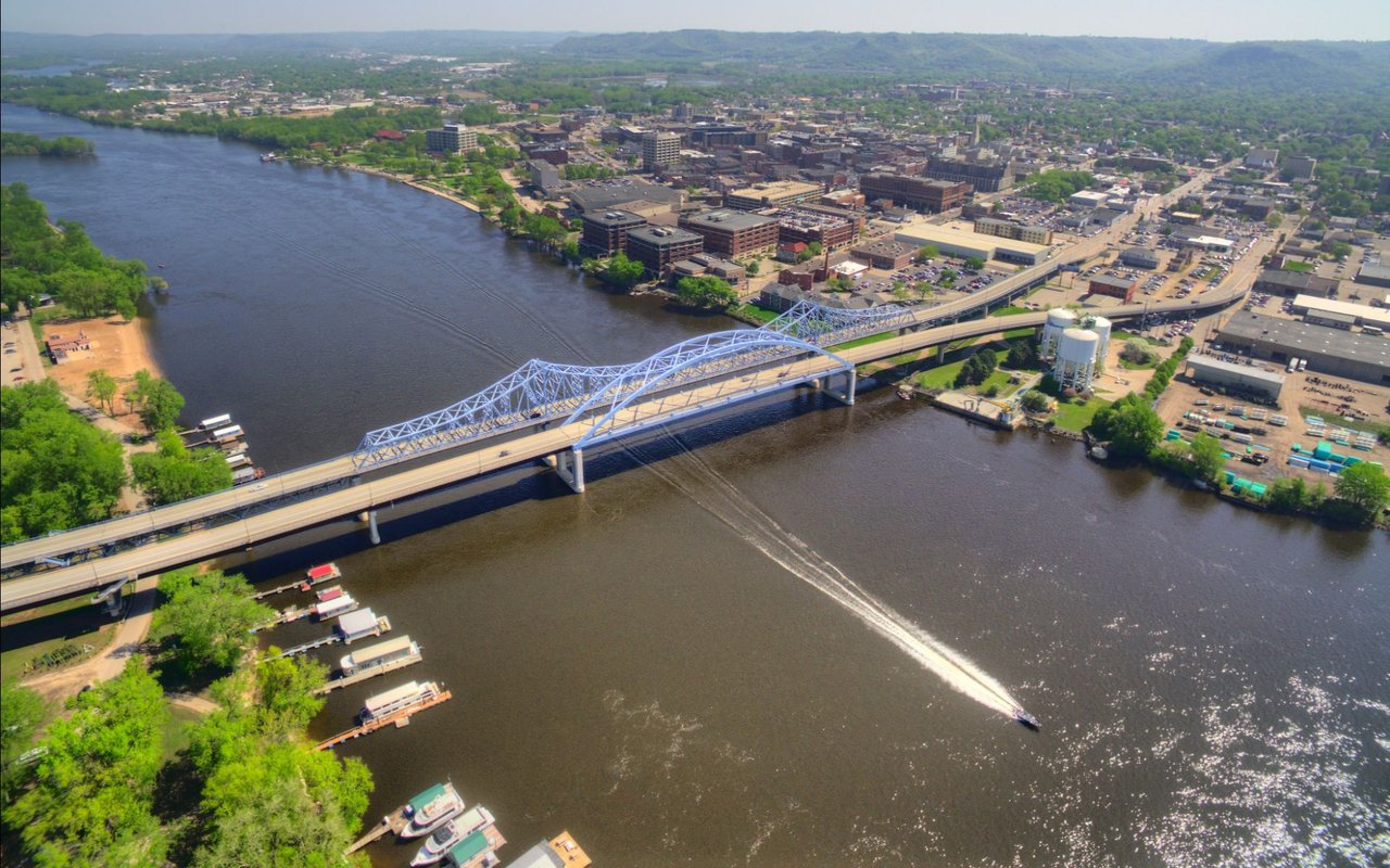 A scenic aerial view of La Crosse County, Wisconsin, showcasing the bluffs, rivers, and small-town neighborhoods that highlight the charm of communities like West Salem, Holmen, and Onalaska.