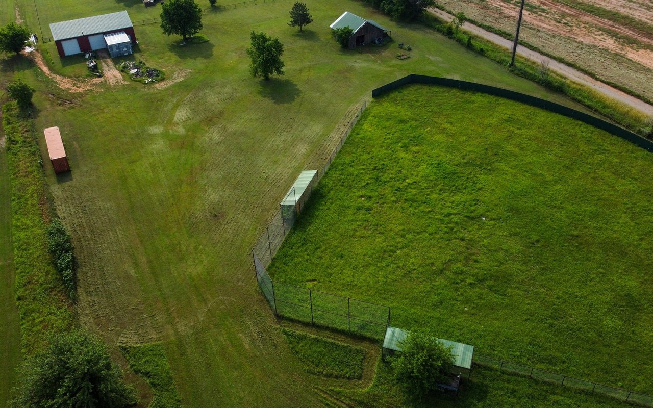 Just Listed: 7.57-Acre Property with a Shop, Barn, Softball Fields, and More!