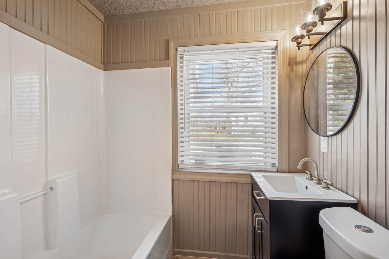 LARGE corner lot in Huntsville! New floors, new paint, renovated bathroom! Great Price!