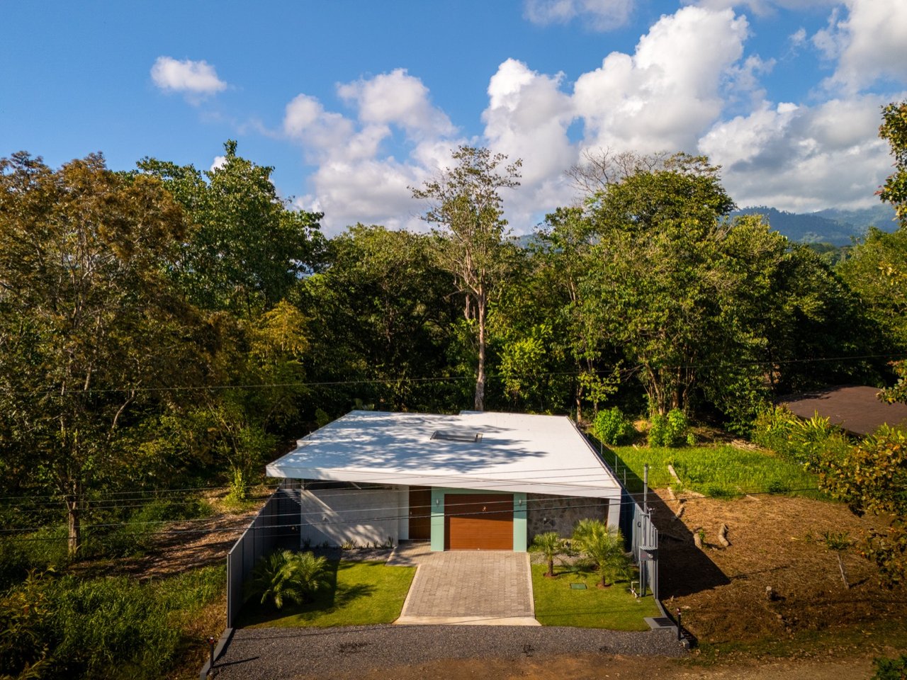 Stunning 3-Bedroom, 2.5-Bathroom Tropical Mid-Century Modern Home – Steps from the Beach