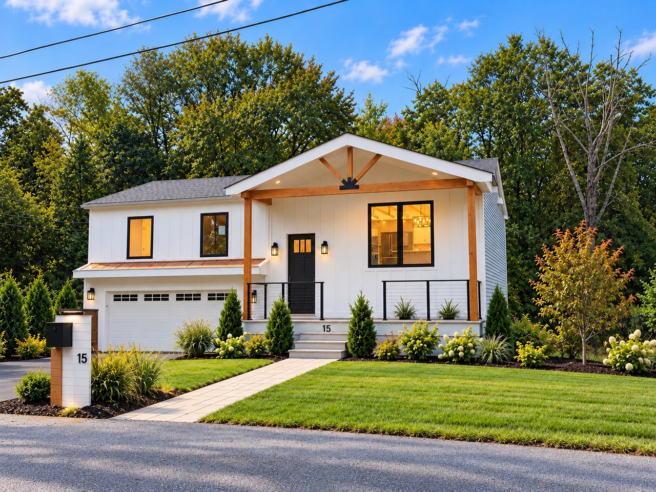 Modern white two-story home with a timber-trimmed gabled porch and landscaped front yard.