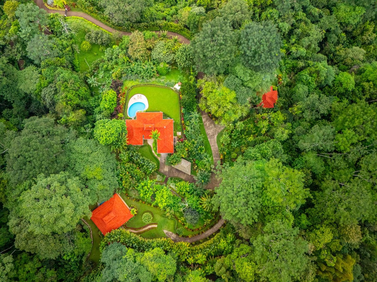 Ocean, jungle & mountain views on a meticulously landscaped 3-home family compound