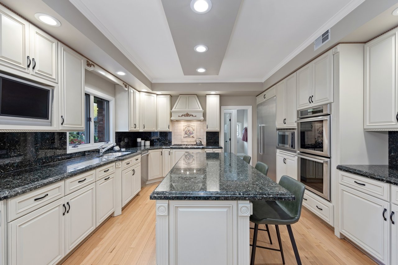 Beautifully Appointed Home in a Gated Community on Over an Acre of Professionally Landscaped Grounds with Pond Views