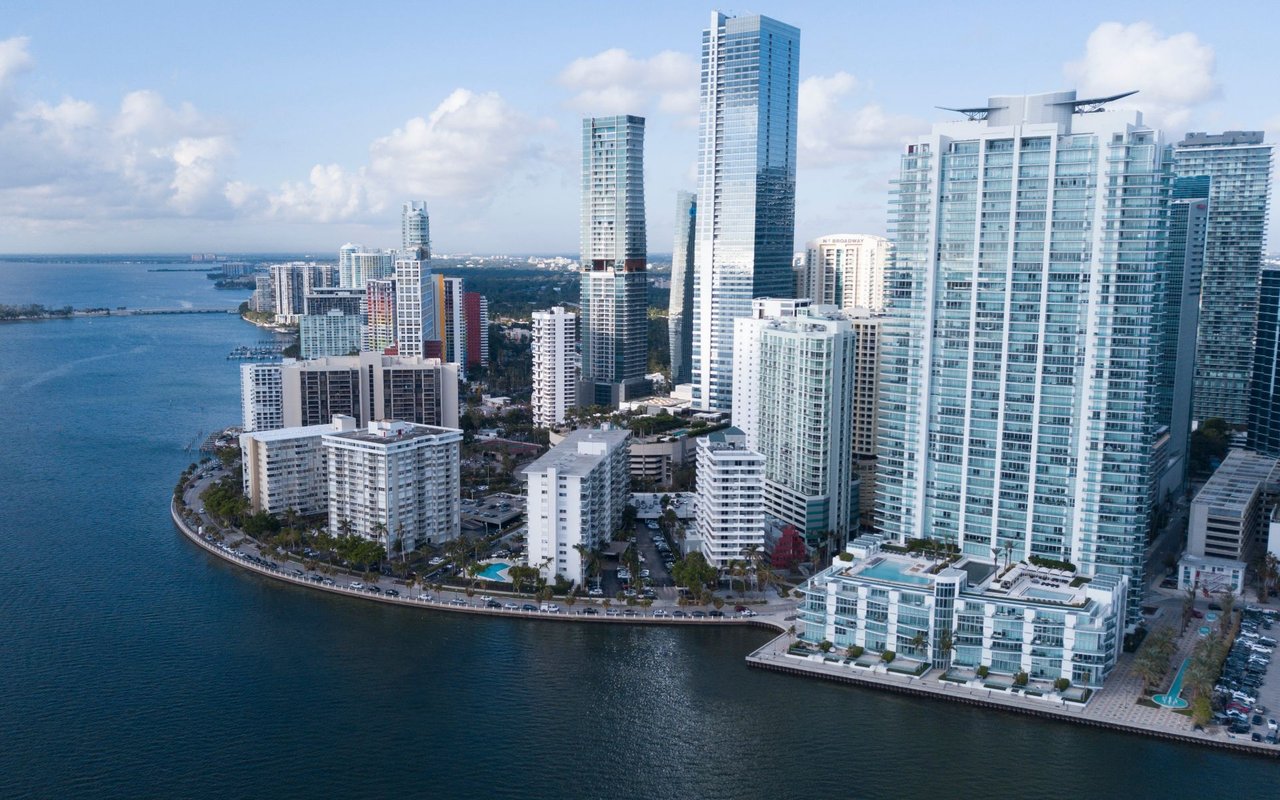 Brickell waterfront skyline with high-rise condominiums along Biscayne Bay.