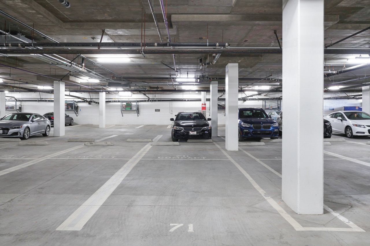 2-car tandem parking spot in underground garage within the building complex