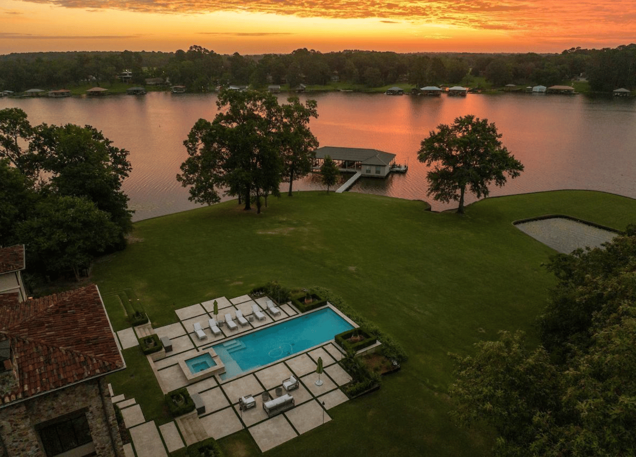 Aeril photo of Lake Tyler and a house with red tile roof and pool