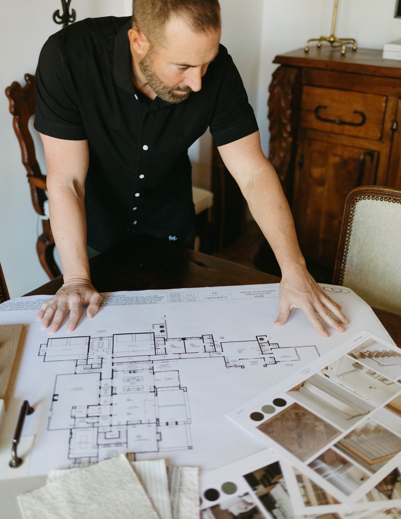 Frank DiMaggio reviewing luxury home plans for Paradise Valley development