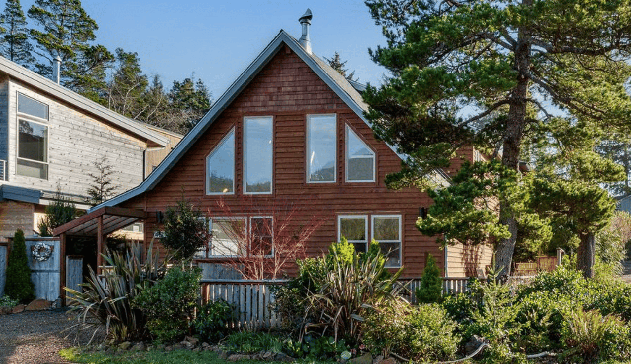 Sold handcrafted chalet-style home at 412 University Ave in Manzanita Oregon with Neahkahnie Mountain views