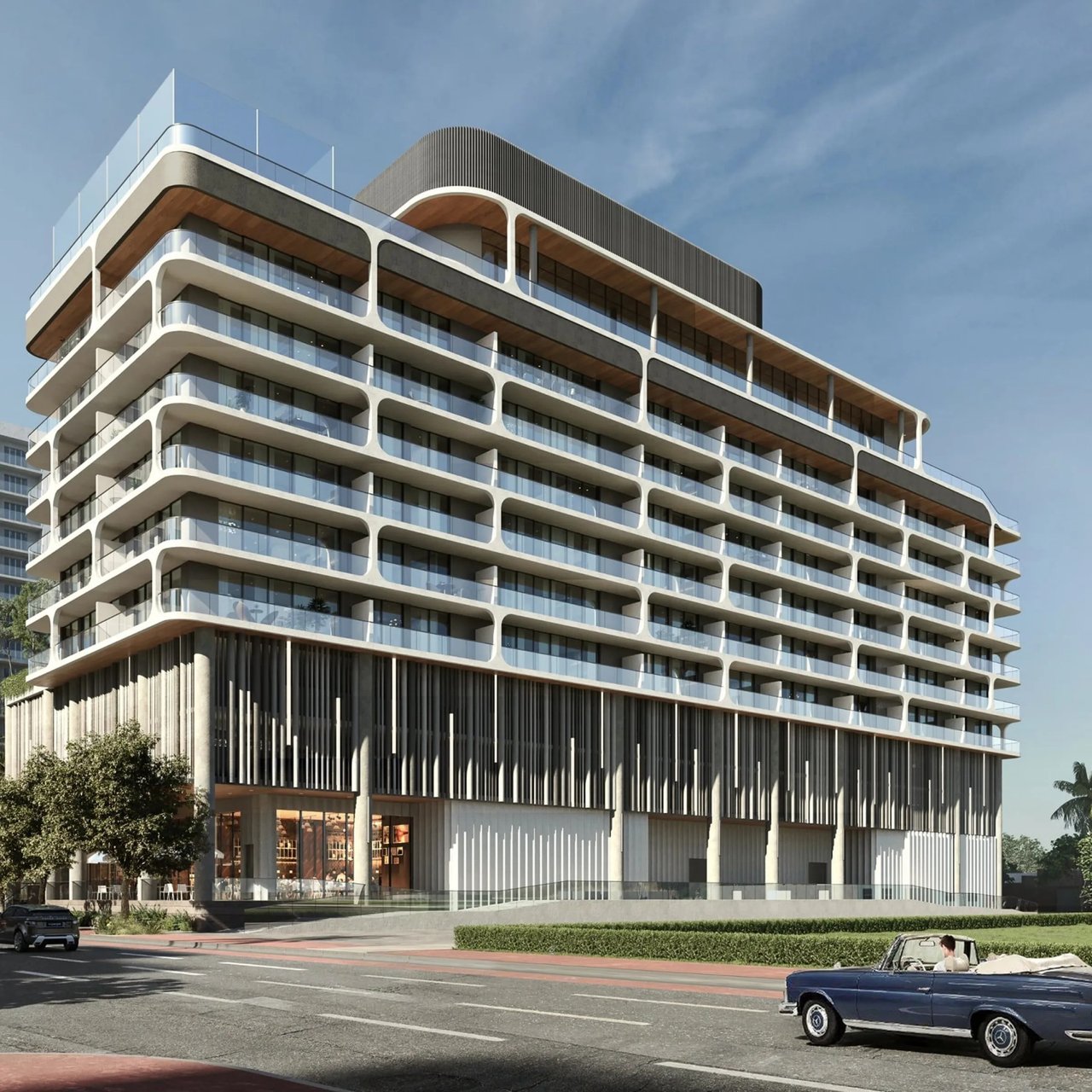 Daytime rendering of Ella Miami Beach with curved balconies and ground-floor storefronts.