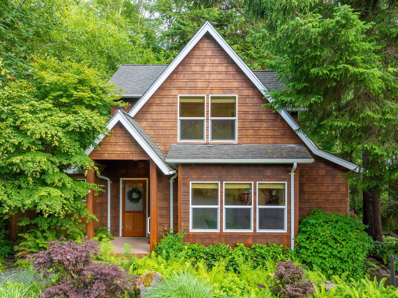 Sold coastal cottage at 9355 DeWolf Rd in Manzanita Oregon with forest preserve privacy and guest quarters