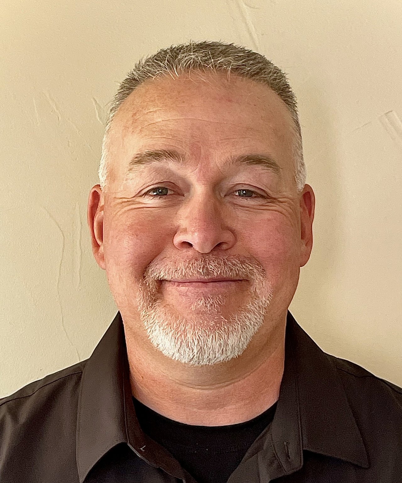 Jason Lengerich headshot with short gray hair and a white goatee.