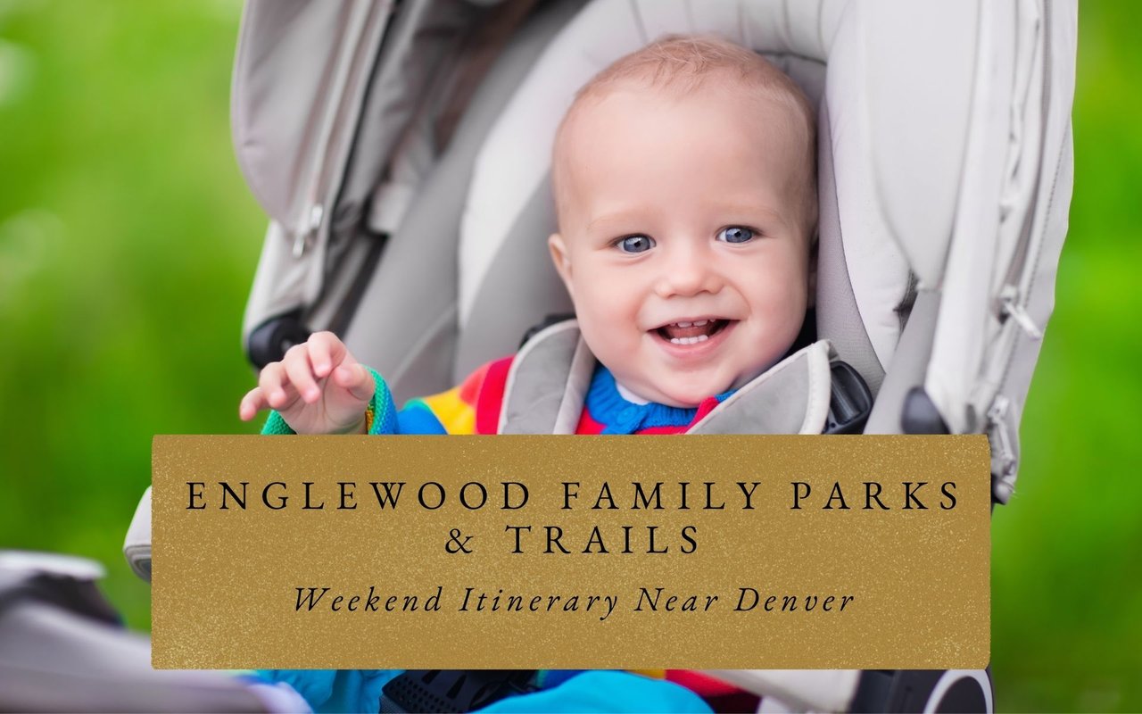 Family walking with a stroller and bikes along a paved trail beside a creek in Englewood, CO