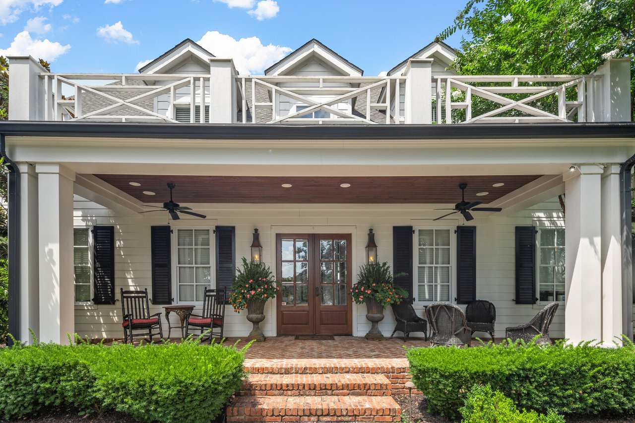 Front entry at 5566 Hill Rd — brick steps and columned porch