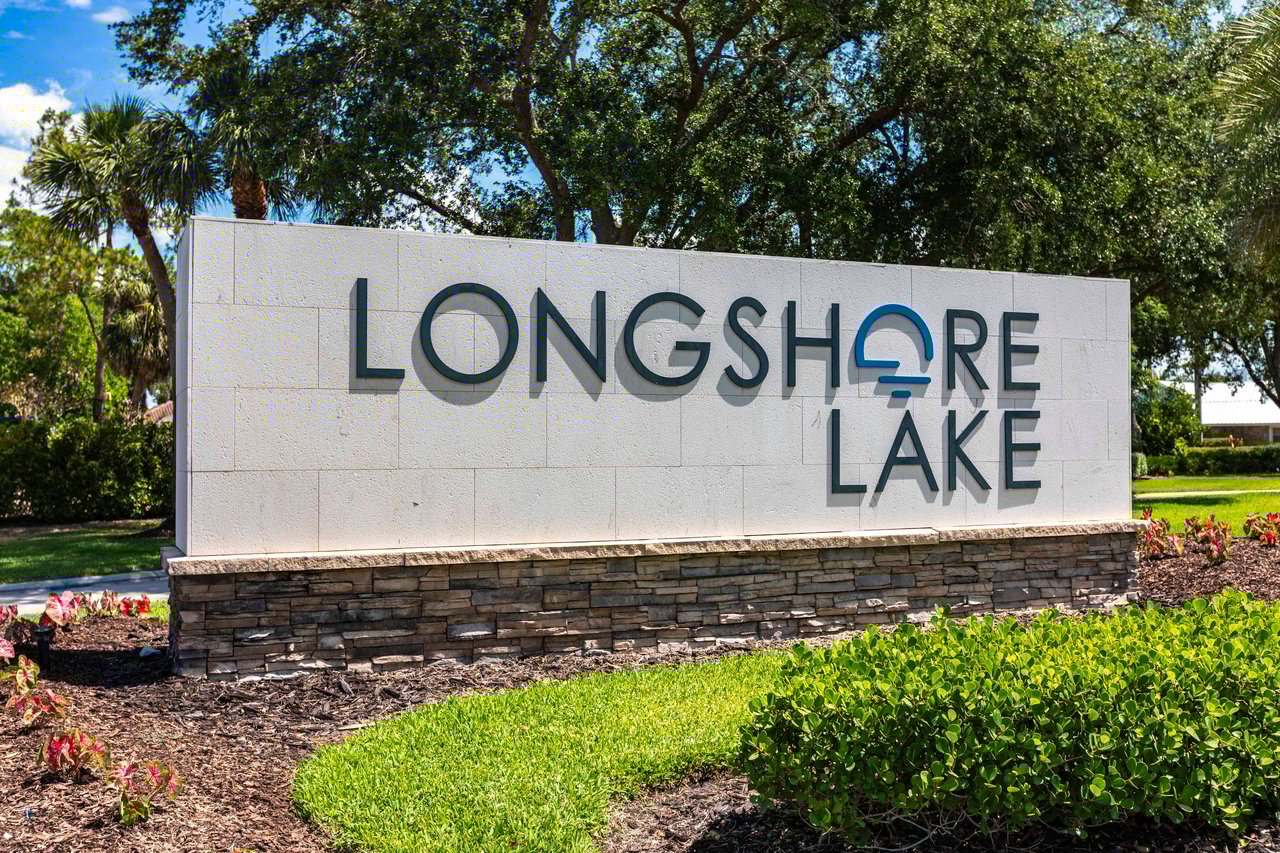 Longshore Lake community entrance sign surrounded by lush Florida landscaping