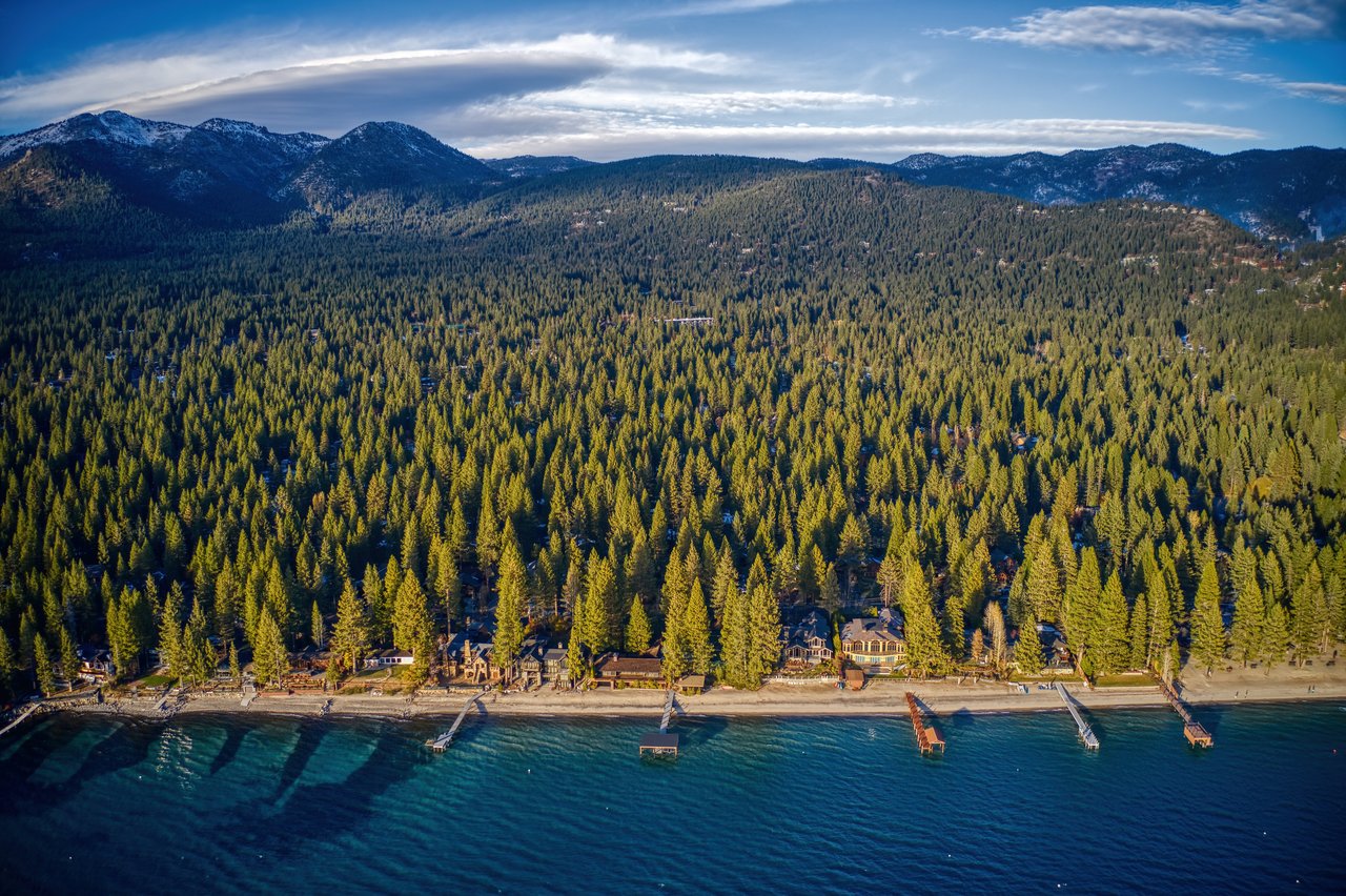 Aerial view of Incline Village homes for sale along Lake Tahoe's Nevada north shore, compared with Zephyr Cove