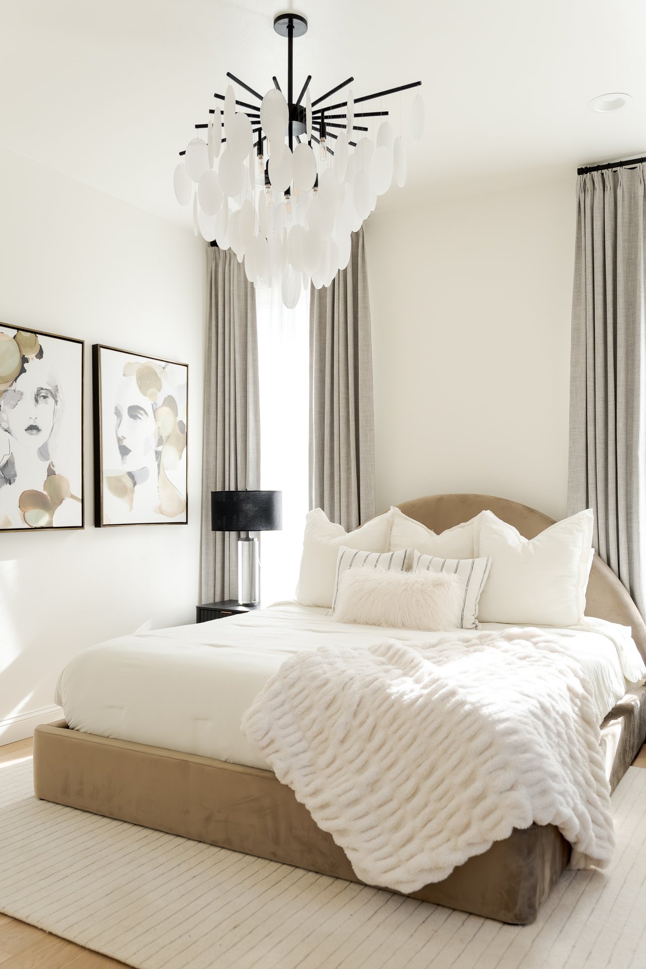 Elegant guest suite in a luxury Oklahoma City home, styled for winter with layered textures and warm neutral tones.