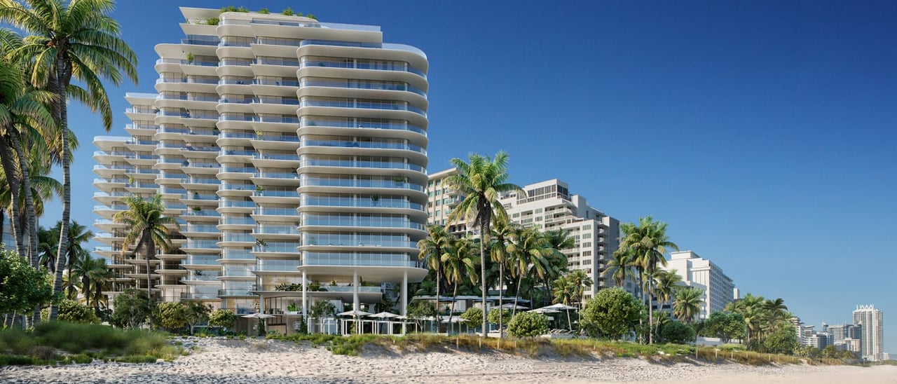 The Perigon Miami Beach condominium with curved balconies beside a palm-lined sandy beach.