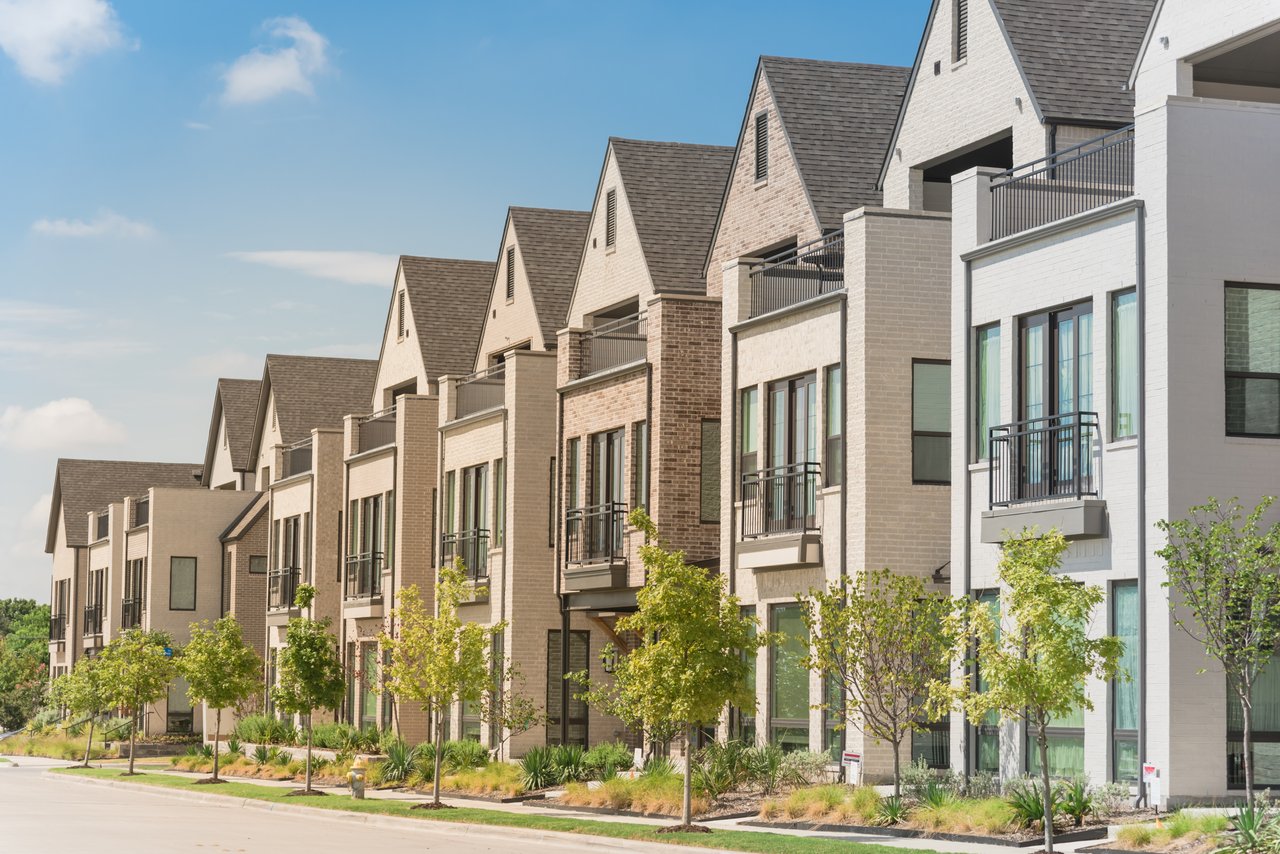 Row of modern townhomes available for rent in Central Texas, featuring clean architecture and neighborhood appeal