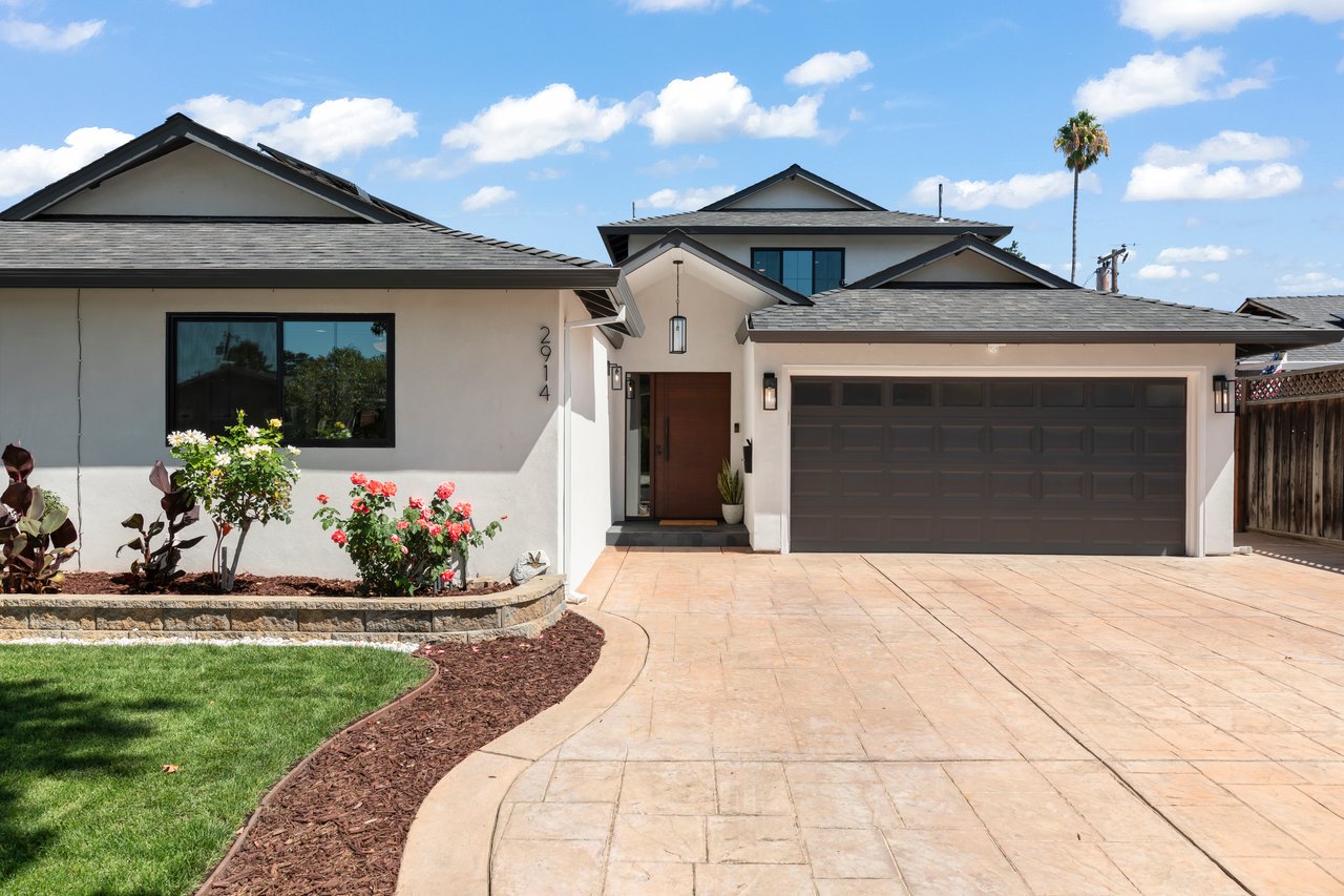 Front exterior of 2914 Lexford Ave with a broad paved driveway and landscaped garden.