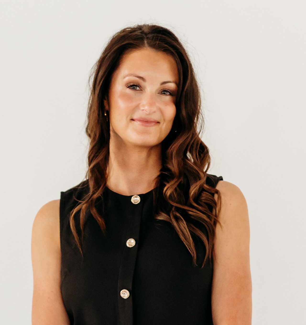 Kaymee Cottrell, Realtor and Luxury Homes Advisor at Brady Luxury Homes, in a sleeveless black top