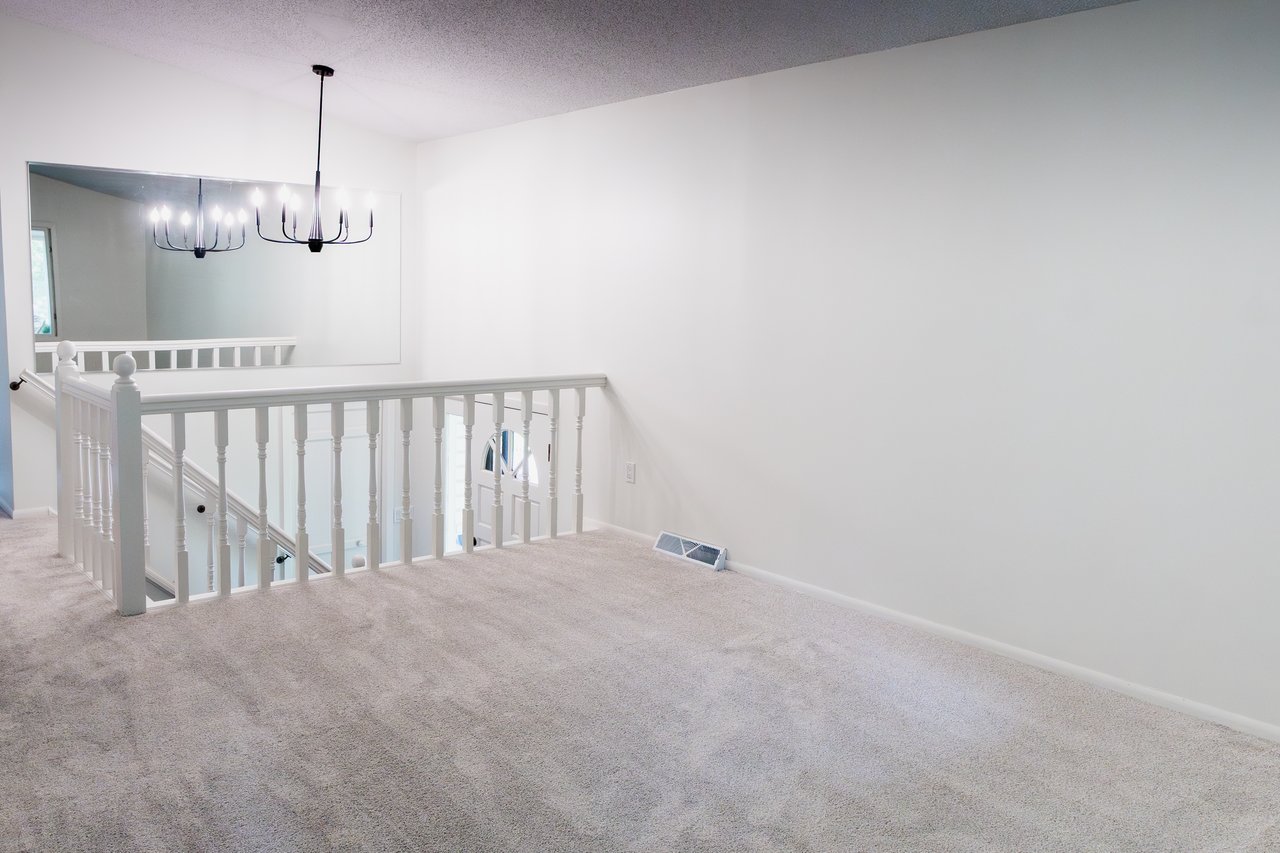 Expansive living room is full of natural light and provides plenty of room