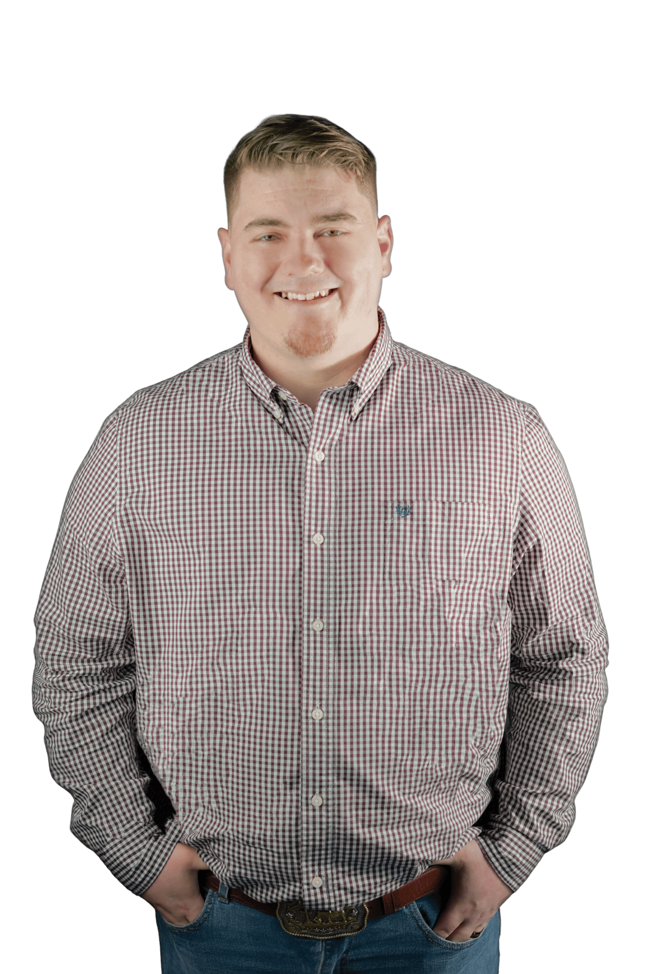 Christian Twist smiling in a red-and-white checked shirt