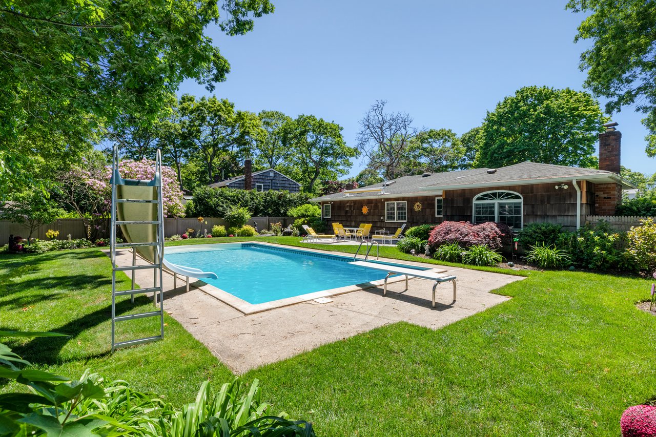 A Quiet Village Setting with a Pool at Its Center