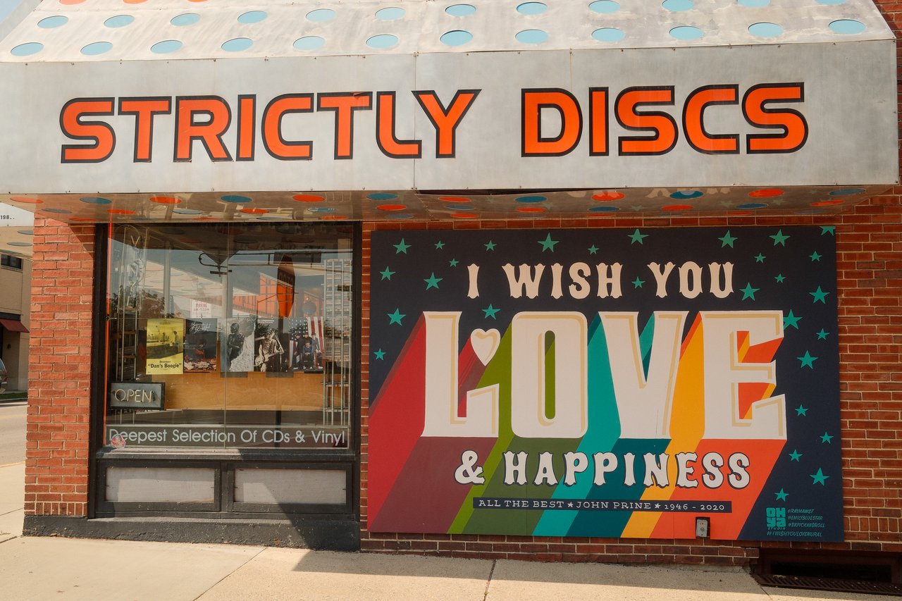 Colorful Love and Happiness mural outside Strictly Discs on Monroe Street in Madison, Wisconsin