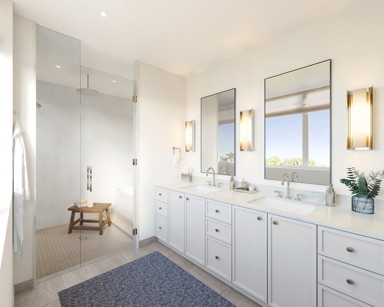 Bright bathroom with a double vanity, glass-enclosed marble shower, and large mirrors.
