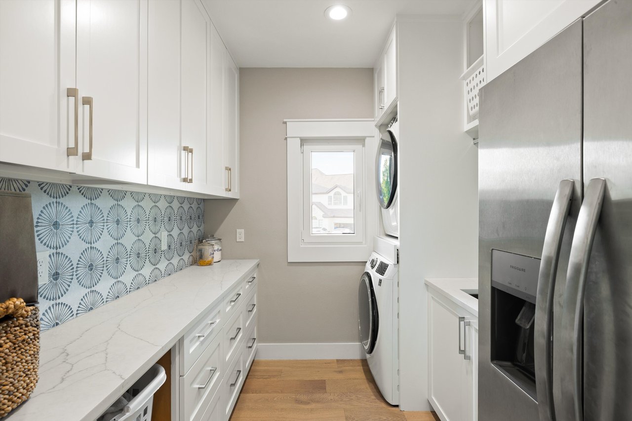 Updated laundry room with second fridge