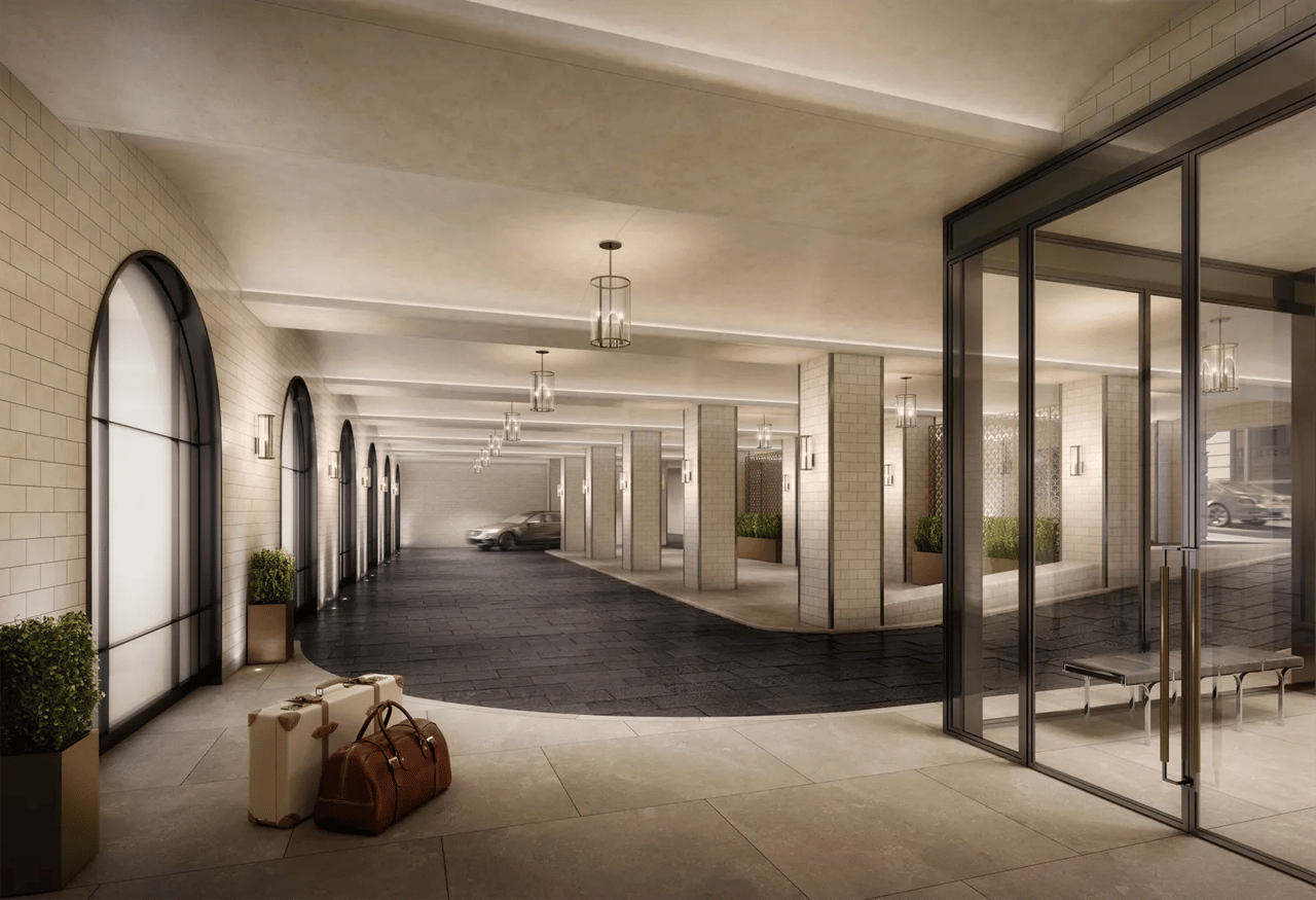108 Leonard lobby with arched windows, glass entry doors, and a covered vehicle drop-off area.