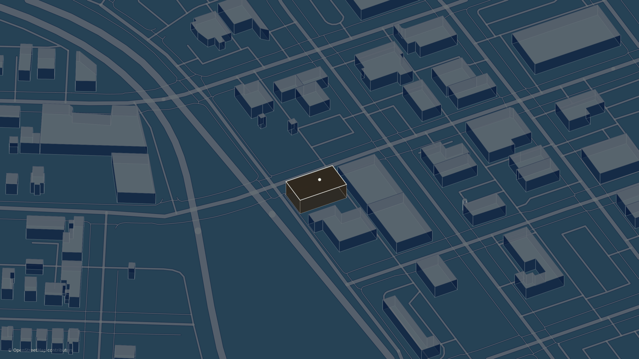 Downtown street map with one brown building highlighted by a white dot.
