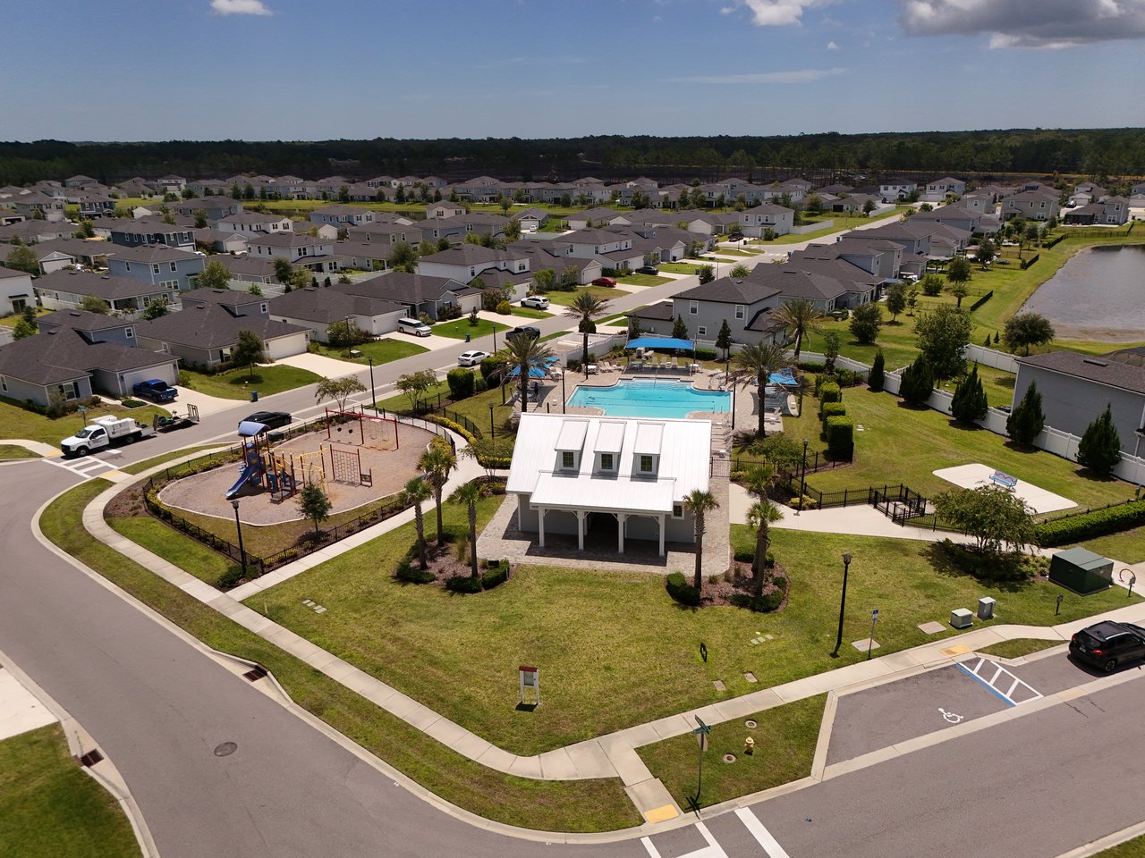 Aerial view of Meadow Ridge homes and the community pool, playground, and pavilion.