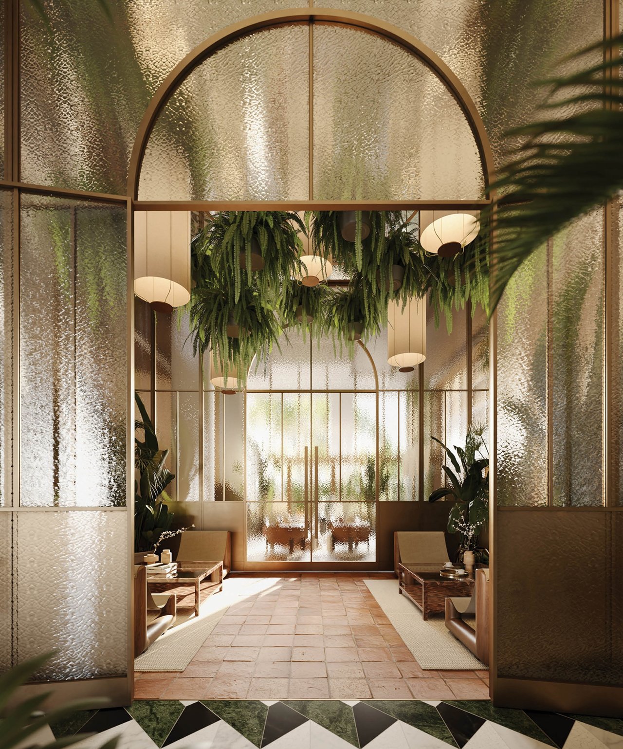 The Well lobby with an arched textured-glass entrance, hanging ferns, and lounge seating.