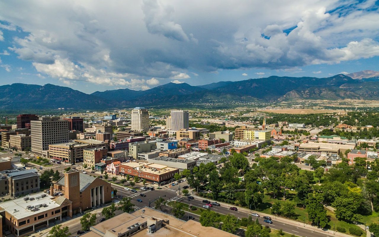 Scenic view of residential areas and natural landscape in Southwest Colorado Springs, featured in real estate and demographics guide