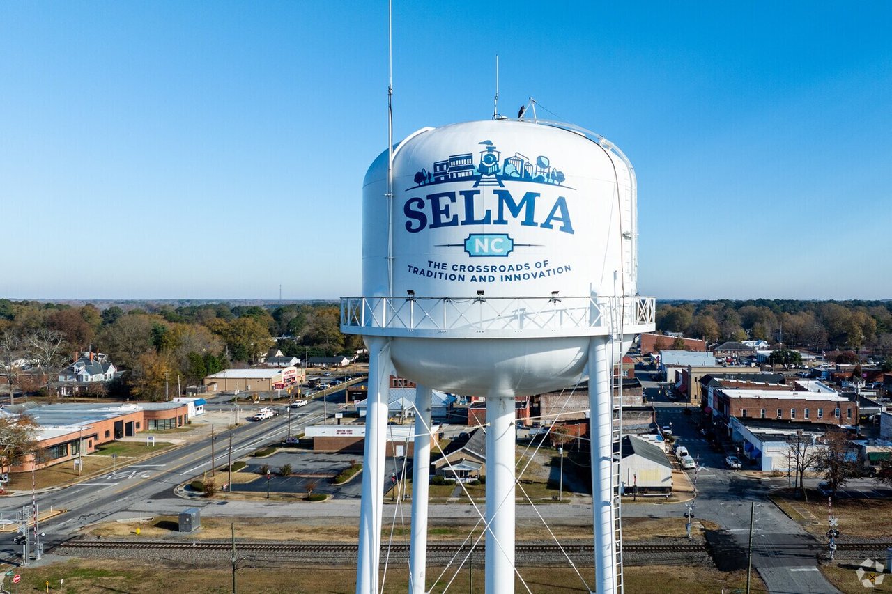 Selma, North Carolina water tower overlooking downtown streets and railroad tracks.