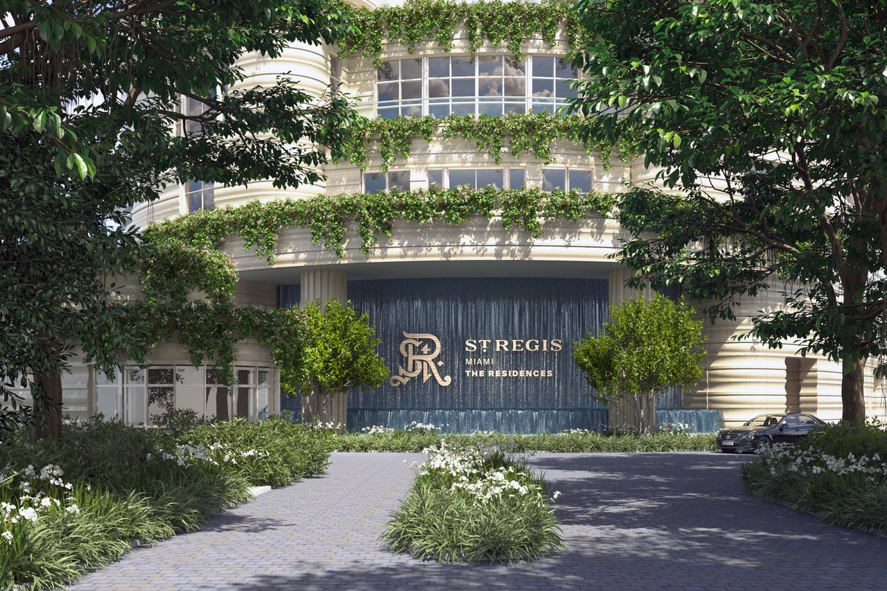 St. Regis Miami Residences entrance with cascading greenery and a central water feature.