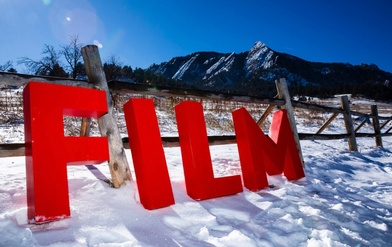 The word “FILM” displayed in front of Boulder’s Flatirons mountains at the Boulder International Film Festival