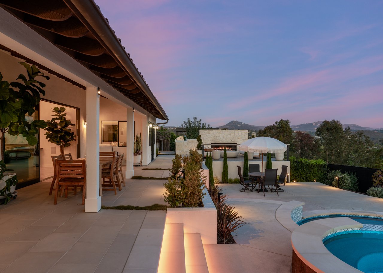 Olivenhain Encinitas home with updated yard, pool & BBQ, featuring 180° views of Rancho Santa Fe—stunning from inside and out.