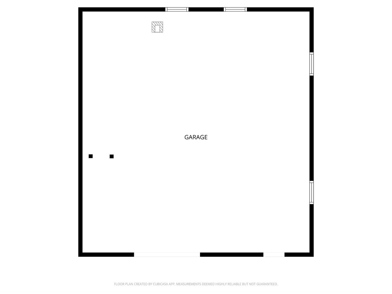 Floor plan of a large rectangular garage with openings along its walls.