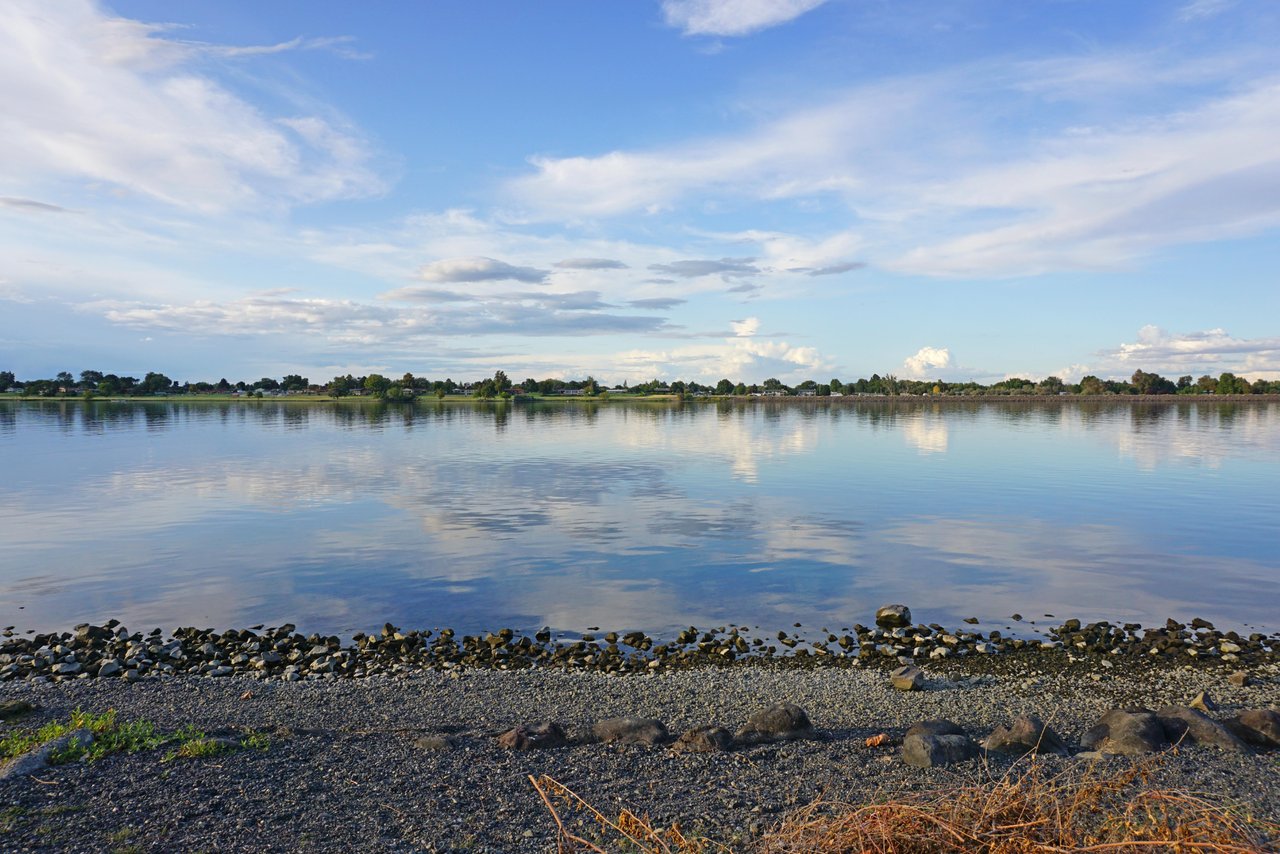 Bright blue sky with white clouds over Columbia River in Tri-Cities Washington
